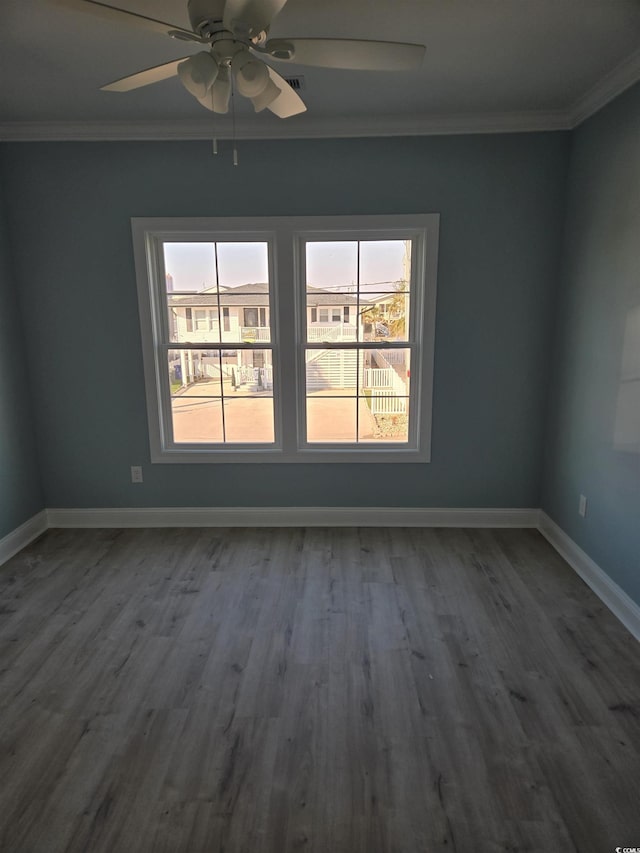 4831 Riverside Dr, North Myrtle Beach, SC 29582 - unfurnished room with crown molding, dark wood finished floors, baseboards, and ceiling fan
