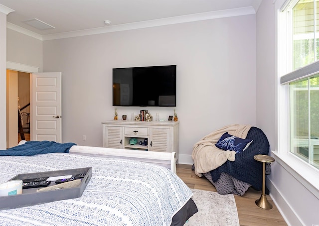 402 Bumble Cir, Murrells Inlet, SC 29576 - bedroom with baseboards, ornamental molding, and wood finished floors
