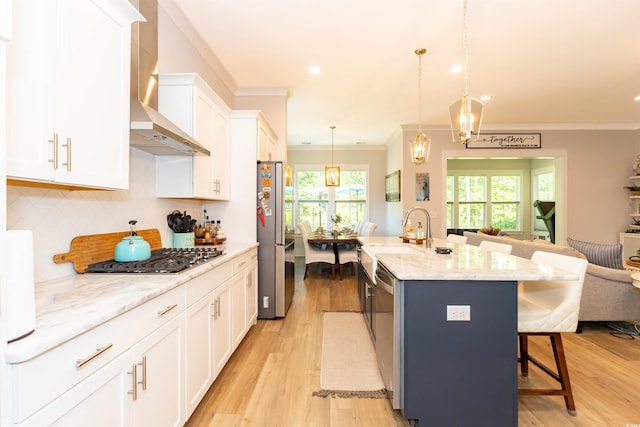 402 Bumble Cir, Murrells Inlet, SC 29576 - kitchen with crown molding, a breakfast bar, open floor plan, wall chimney exhaust hood, and stainless steel appliances