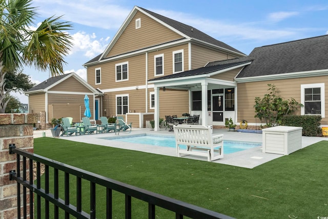 712 Crystal Water Way, Myrtle Beach, SC 29579 - rear view of house with a yard, a patio, an outbuilding, and a sunroom