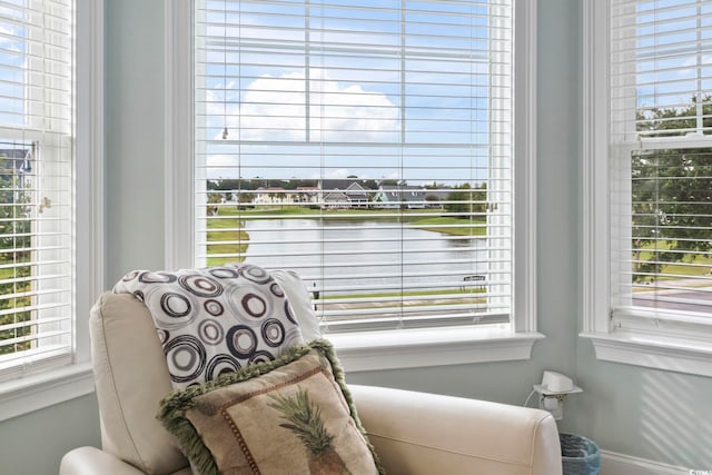 interior details with baseboards and a water view