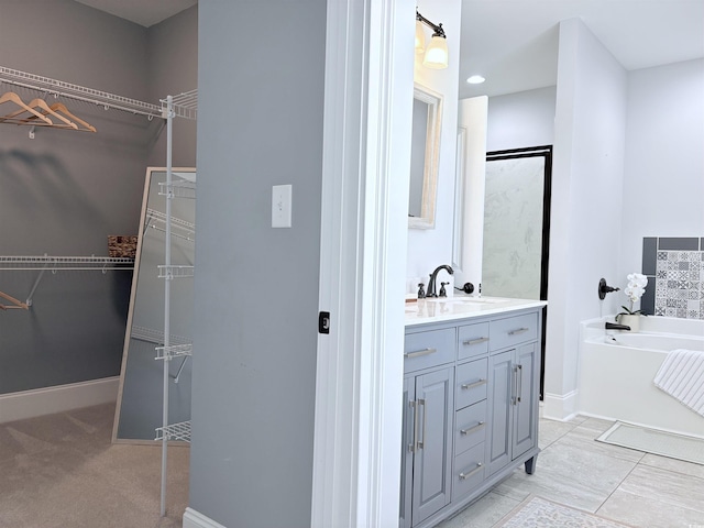 712 Crystal Water Way, Myrtle Beach, SC 29579 - bathroom featuring a bath, vanity, and a walk in closet
