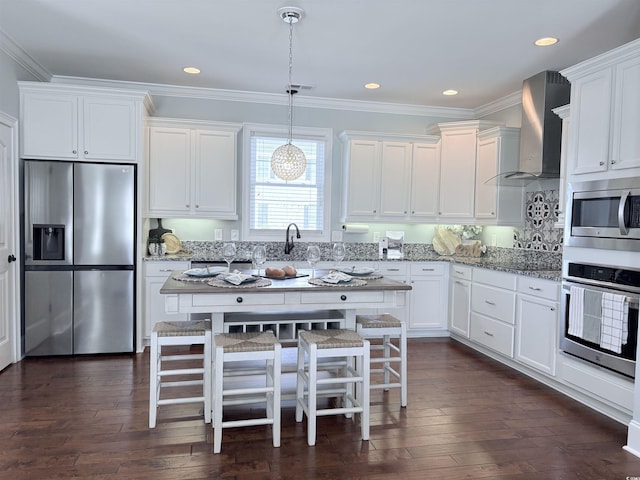 712 Crystal Water Way, Myrtle Beach, SC 29579 - kitchen featuring stainless steel appliances, wall chimney exhaust hood, crown molding, white cabinets, and light stone counters