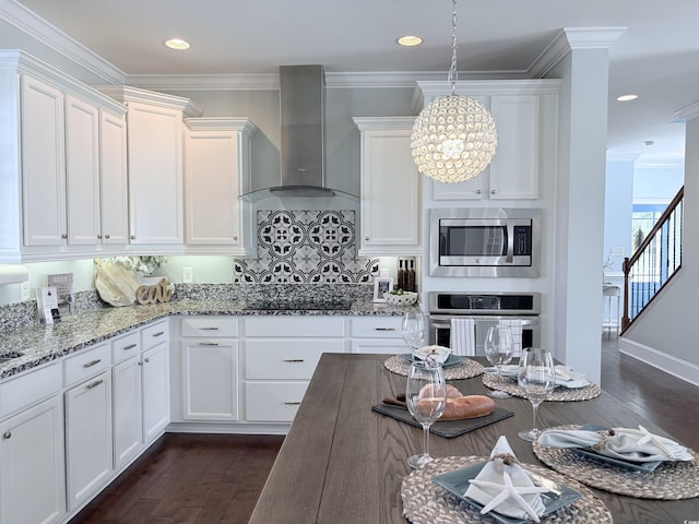 712 Crystal Water Way, Myrtle Beach, SC 29579 - kitchen featuring appliances with stainless steel finishes, wall chimney range hood, dark wood-style flooring, white cabinetry, and recessed lighting
