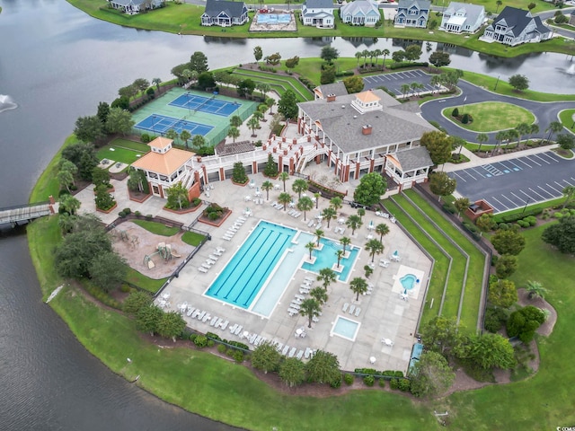 birds eye view of property featuring a water view