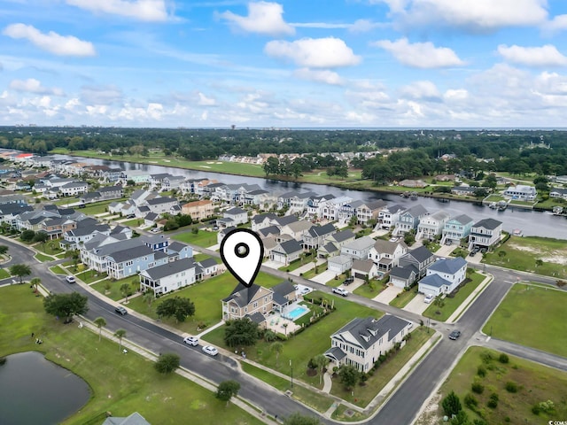 bird's eye view featuring a residential view and a water view