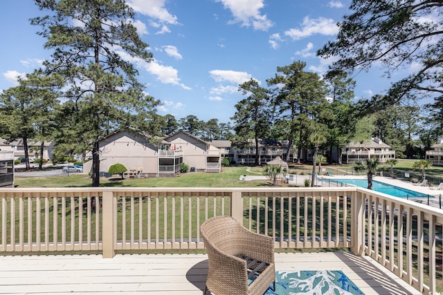 3015 Old Bryan Dr Unit 10-7, Myrtle Beach, SC 29577 - deck featuring a community pool, a residential view, and a lawn