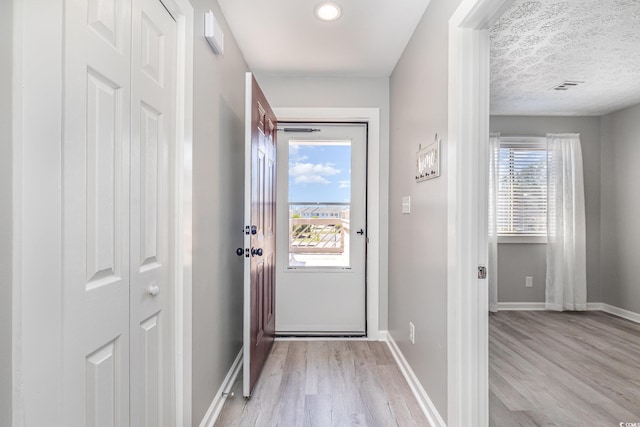 3015 Old Bryan Dr Unit 10-7, Myrtle Beach, SC 29577 - entryway featuring light wood-type flooring, baseboards, and a healthy amount of sunlight