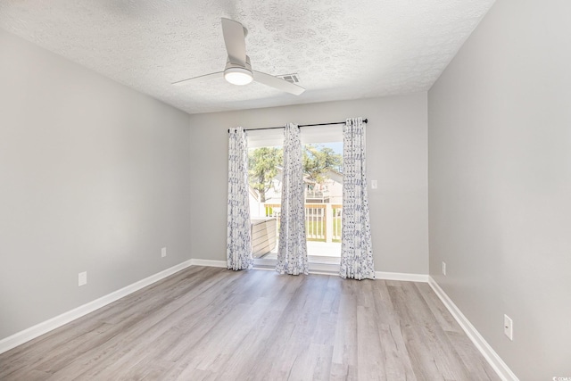 3015 Old Bryan Dr Unit 10-7, Myrtle Beach, SC 29577 - spare room featuring baseboards, a textured ceiling, a ceiling fan, visible vents, and light wood-style floors