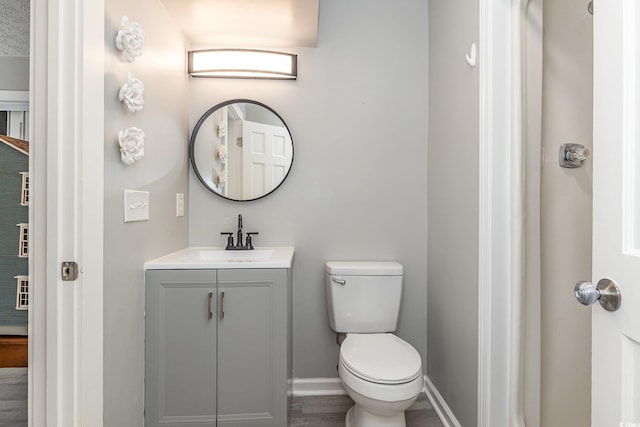 3015 Old Bryan Dr Unit 10-7, Myrtle Beach, SC 29577 - bathroom featuring toilet, wood finished floors, vanity, and baseboards