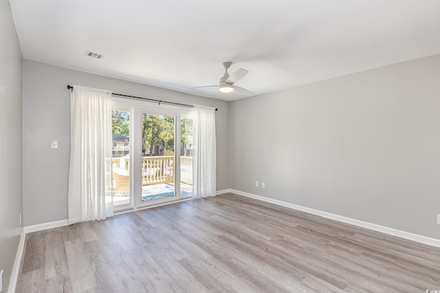 3015 Old Bryan Dr Unit 10-7, Myrtle Beach, SC 29577 - spare room featuring light wood-style flooring, visible vents, baseboards, and a ceiling fan
