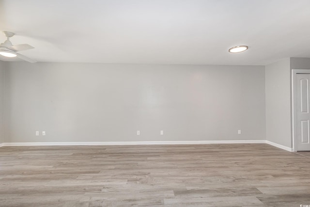 3015 Old Bryan Dr Unit 10-7, Myrtle Beach, SC 29577 - unfurnished room with light wood-style floors, ceiling fan, and baseboards