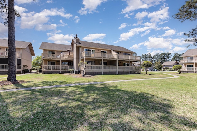 3015 Old Bryan Dr Unit 10-7, Myrtle Beach, SC 29577 - back of property featuring a yard and a chimney