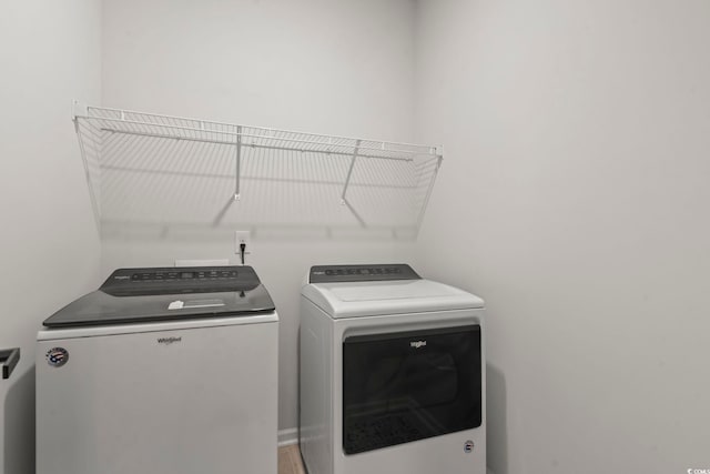 laundry area featuring washing machine and clothes dryer