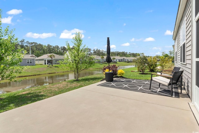 view of patio with a water view and a residential view