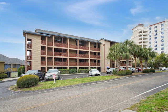 223 Maison Dr Unit F-4, Myrtle Beach, SC 29572 - view of building exterior with uncovered parking