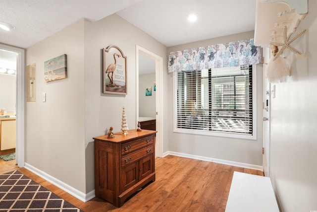 223 Maison Dr Unit F-4, Myrtle Beach, SC 29572 - hall featuring light wood-style flooring, baseboards, and a textured ceiling