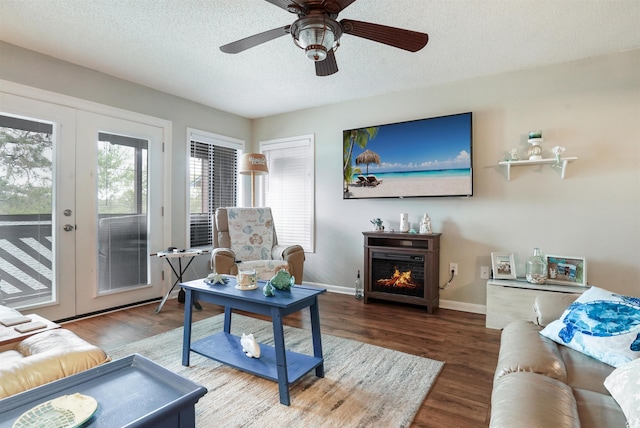 223 Maison Dr Unit F-4, Myrtle Beach, SC 29572 - living area featuring french doors, baseboards, wood finished floors, and a textured ceiling