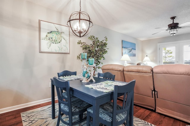 223 Maison Dr Unit F-4, Myrtle Beach, SC 29572 - dining room with baseboards, a textured ceiling, ceiling fan with notable chandelier, and wood finished floors