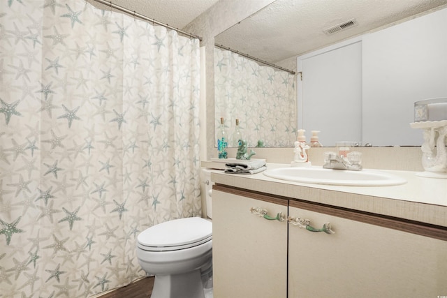 223 Maison Dr Unit F-4, Myrtle Beach, SC 29572 - full bathroom with visible vents, toilet, vanity, and a textured ceiling