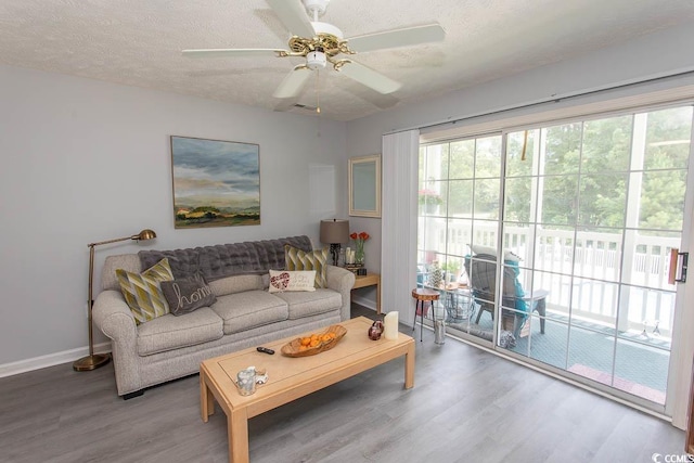 646 Tupelo Ln Unit 4E, Longs, SC 29568 - living area featuring wood finished floors, a textured ceiling, and a ceiling fan