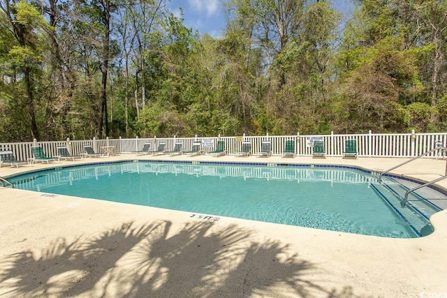 646 Tupelo Ln Unit 4E, Longs, SC 29568 - community pool featuring a patio area