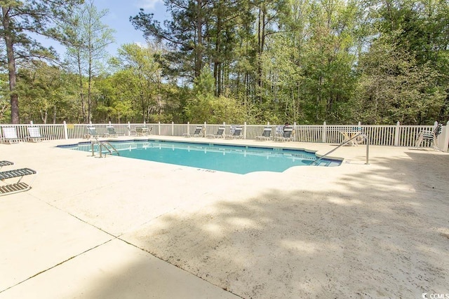 646 Tupelo Ln Unit 4E, Longs, SC 29568 - community pool featuring a patio area