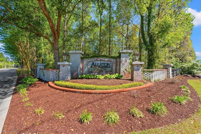 community sign featuring fence
