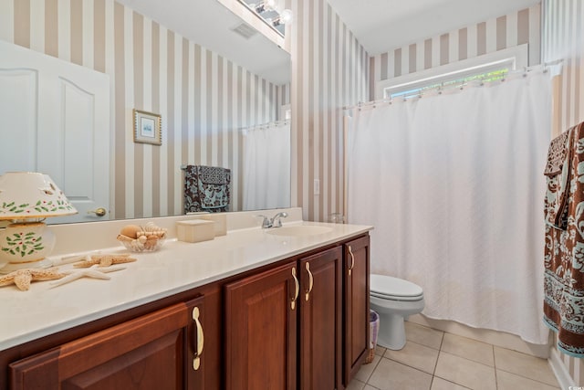 full bath featuring vanity, tile patterned flooring, wallpapered walls, and toilet