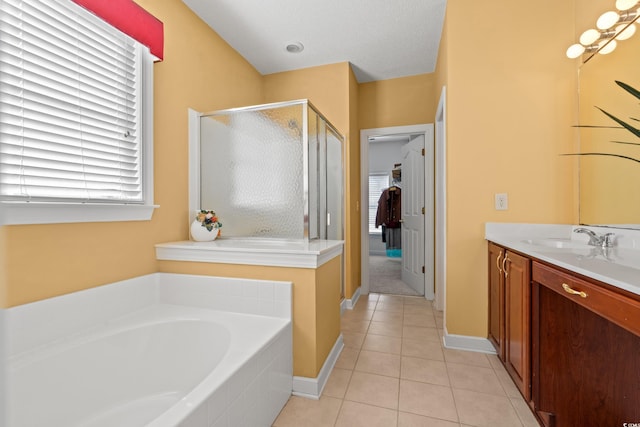 full bathroom with a garden tub, vanity, tile patterned flooring, baseboards, and a shower stall