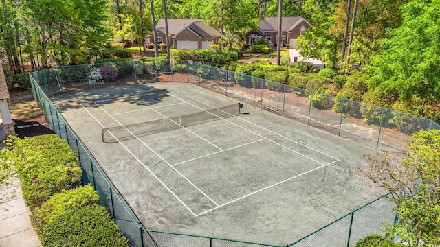 view of sport court with fence