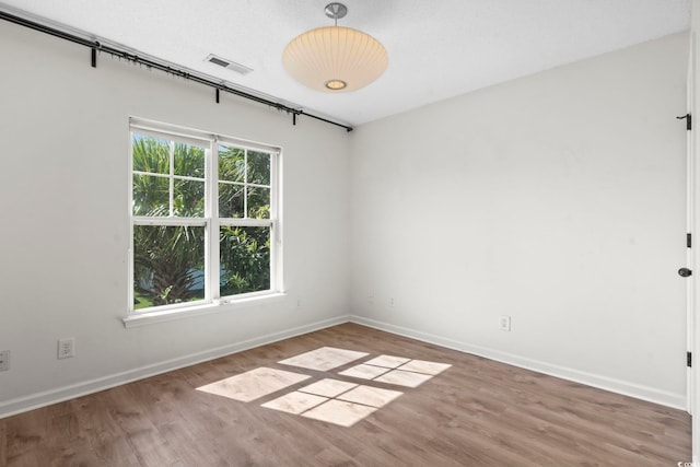 405 Emerson Dr, Myrtle Beach, SC 29579 - unfurnished room with wood finished floors, baseboards, and visible vents