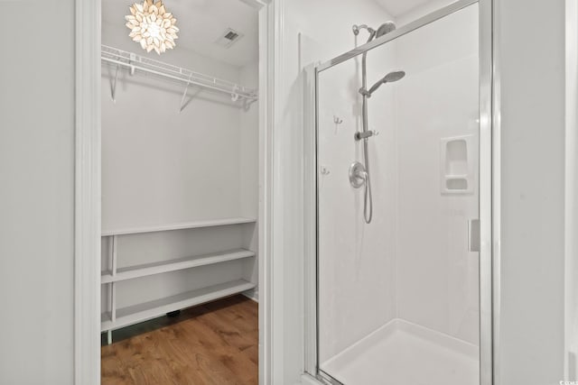 405 Emerson Dr, Myrtle Beach, SC 29579 - full bath featuring a walk in closet, visible vents, a stall shower, and wood finished floors