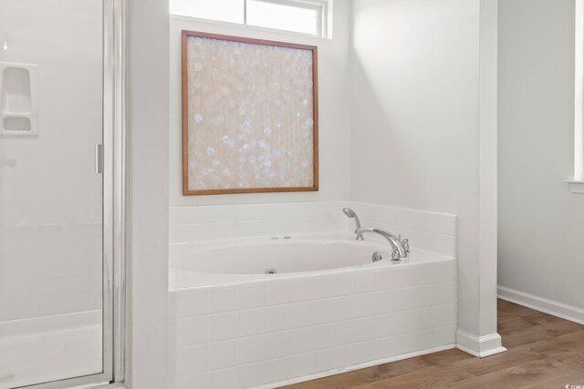 405 Emerson Dr, Myrtle Beach, SC 29579 - bathroom with a bath, a stall shower, wood finished floors, and baseboards