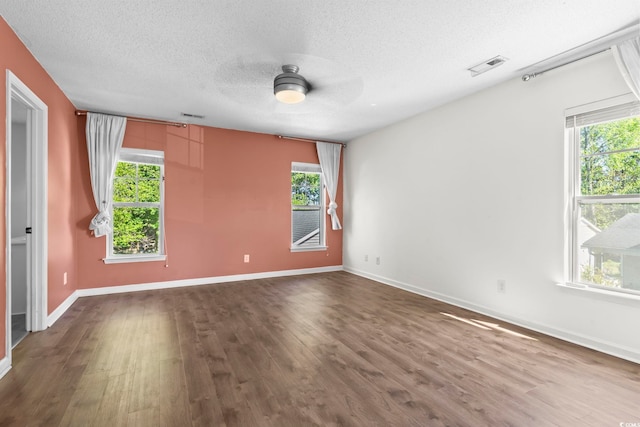 405 Emerson Dr, Myrtle Beach, SC 29579 - unfurnished room featuring baseboards, dark wood-style floors, a textured ceiling, visible vents, and ceiling fan