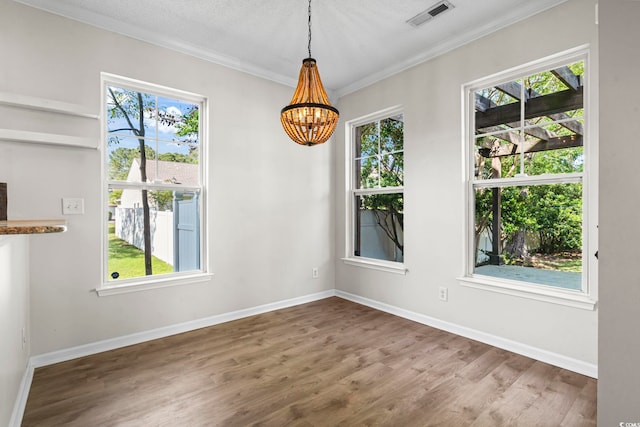405 Emerson Dr, Myrtle Beach, SC 29579 - unfurnished dining area with visible vents, baseboards, a notable chandelier, ornamental molding, and wood finished floors