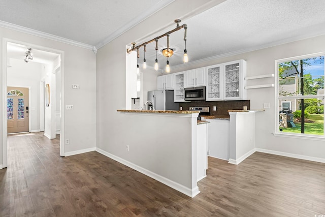 405 Emerson Dr, Myrtle Beach, SC 29579 - kitchen with white cabinets, glass insert cabinets, dark wood-style floors, and appliances with stainless steel finishes