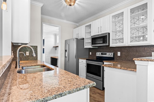 405 Emerson Dr, Myrtle Beach, SC 29579 - kitchen featuring a sink, appliances with stainless steel finishes, white cabinetry, wood finished floors, and stone countertops
