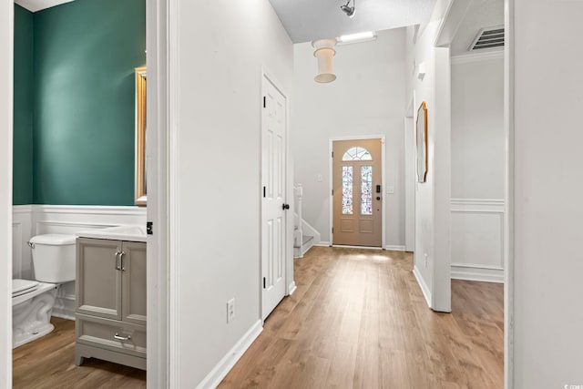 405 Emerson Dr, Myrtle Beach, SC 29579 - entryway featuring light wood-type flooring, wainscoting, and visible vents