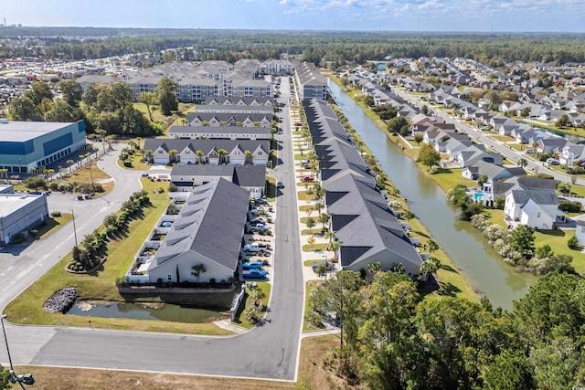aerial view of residential area with a nearby body of water