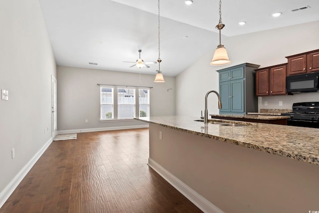 kitchen with black appliances, a sink, a ceiling fan, dark wood-style floors, and vaulted ceiling