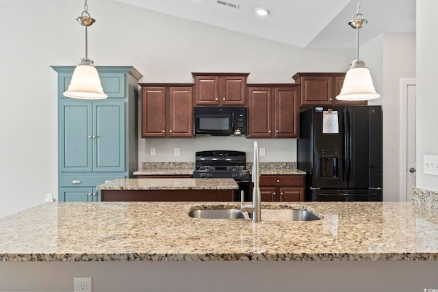 kitchen with black appliances, lofted ceiling, light stone countertops, a sink, and hanging light fixtures