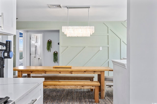 dining space with an inviting chandelier and visible vents