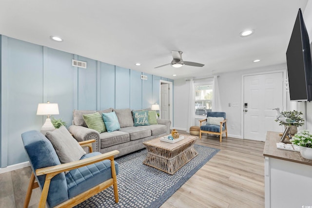 living room with a ceiling fan, visible vents, light wood-style flooring, and recessed lighting