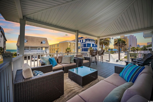 view of patio featuring a wooden deck and an outdoor living space