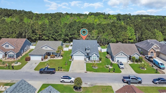 aerial perspective of suburban area with a heavily wooded area
