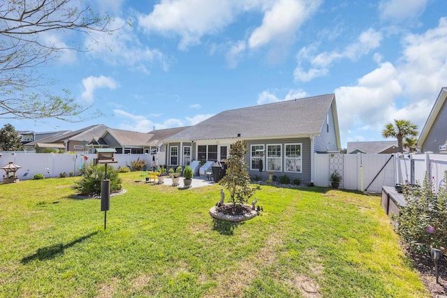 back of house featuring a patio and a gate