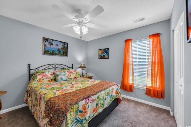 bedroom with multiple windows, carpet floors, and baseboards