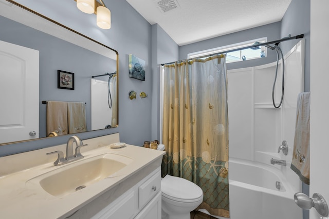 bathroom featuring shower / bath combo, toilet, and vanity