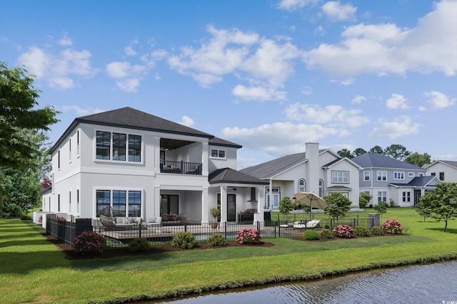 1315 Ashboro Ct, Myrtle Beach, SC 29579 - back of property featuring a ceiling fan, fence, a lawn, and a balcony